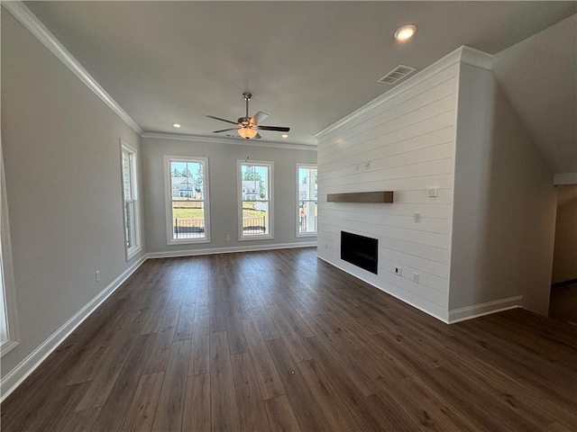 unfurnished living room with ceiling fan, a fireplace, dark hardwood / wood-style floors, and ornamental molding