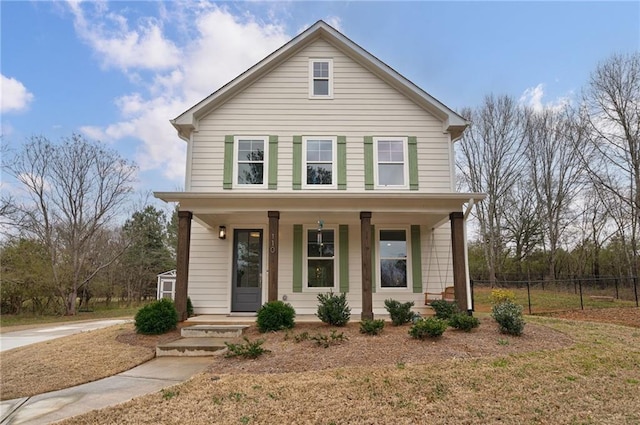 view of front of house featuring a porch and fence