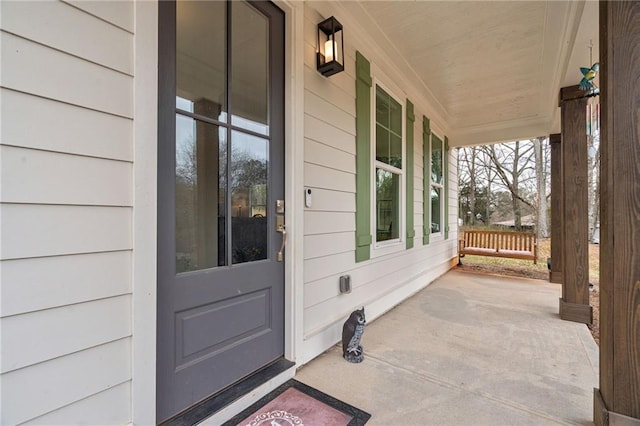 property entrance featuring a porch