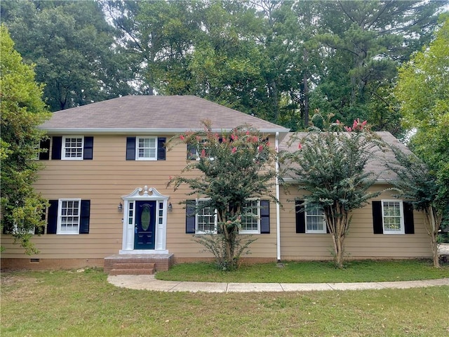 colonial home with a front lawn