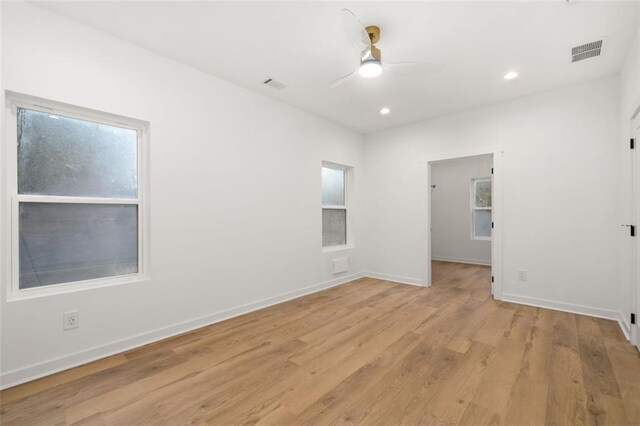 bathroom with hardwood / wood-style floors, vanity, and shower with separate bathtub