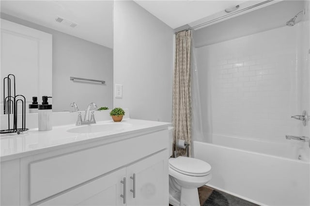 bathroom featuring visible vents, toilet, vanity, and shower / bath combination with curtain