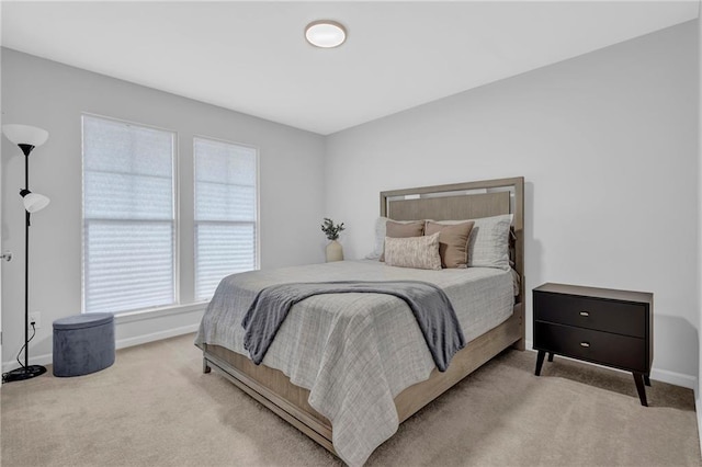 carpeted bedroom with baseboards