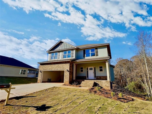 view of front of home with a porch and a garage