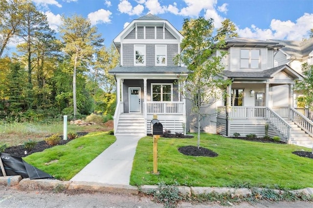 view of front facade featuring covered porch and a front yard