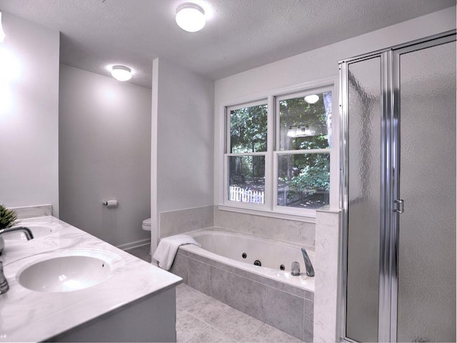 750 Whitehall Way, Roswell, GA 30076 - full bathroom featuring a whirlpool tub, a stall shower, double vanity, a textured ceiling, and tile patterned floors