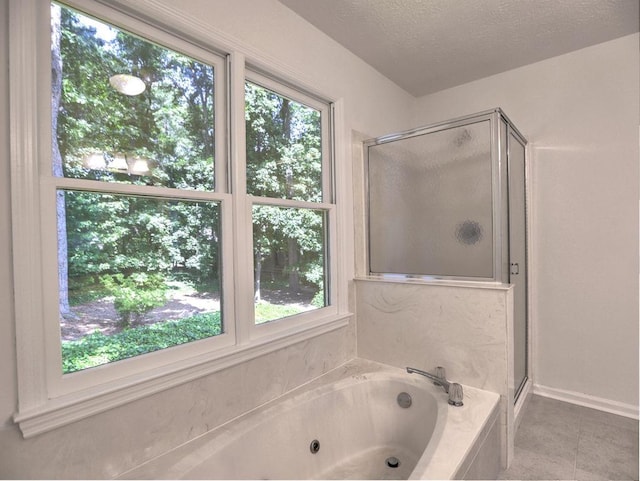 750 Whitehall Way, Roswell, GA 30076 - full bathroom with a stall shower, a tub with jets, and a textured ceiling