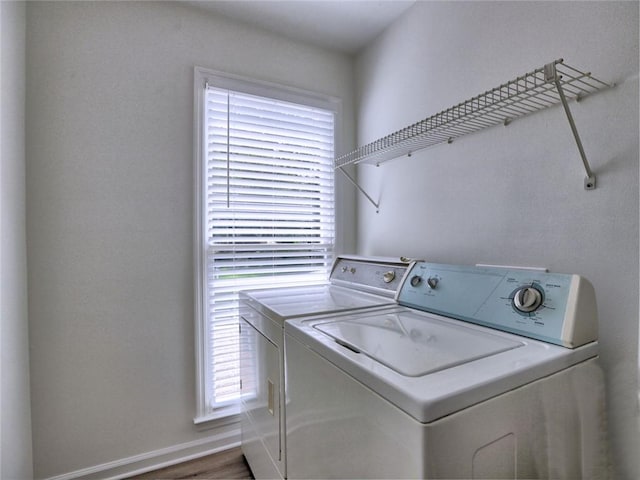 750 Whitehall Way, Roswell, GA 30076 - washroom featuring washer and clothes dryer, plenty of natural light, and wood finished floors