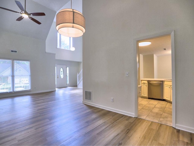 750 Whitehall Way, Roswell, GA 30076 - unfurnished living room featuring high vaulted ceiling, ceiling fan, and light wood-style floors
