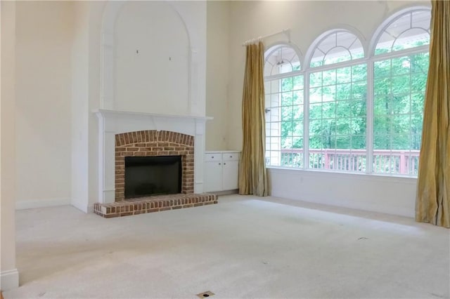 430 English Ivy Way, Woodstock, GA 30188 - unfurnished living room featuring carpet, a brick fireplace, and baseboards