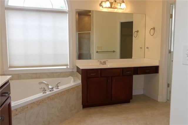 430 English Ivy Way, Woodstock, GA 30188 - bathroom featuring vanity, plenty of natural light, a garden tub, and a stall shower