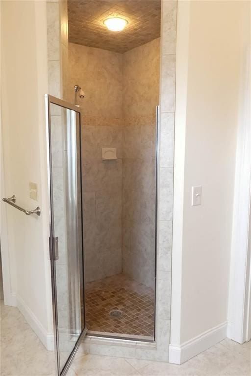 430 English Ivy Way, Woodstock, GA 30188 - full bathroom with a stall shower and baseboards