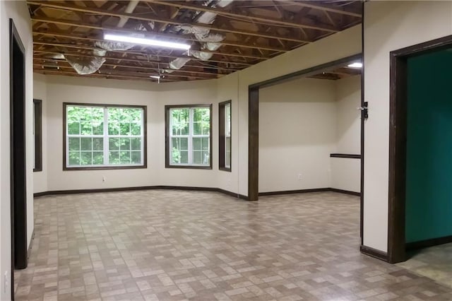 430 English Ivy Way, Woodstock, GA 30188 - unfurnished room with baseboards and brick patterned flooring