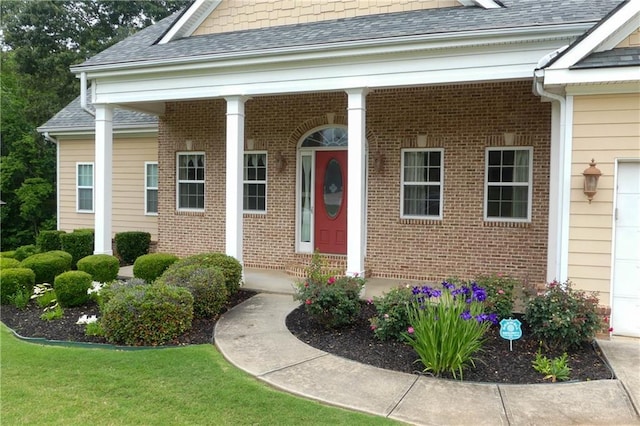 430 English Ivy Way, Woodstock, GA 30188 - property entrance featuring brick siding, a porch, and roof with shingles