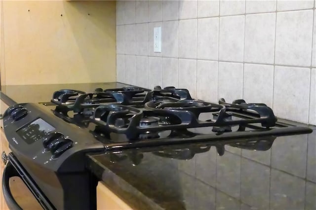 430 English Ivy Way, Woodstock, GA 30188 - kitchen view of decorative backsplash and black gas range oven