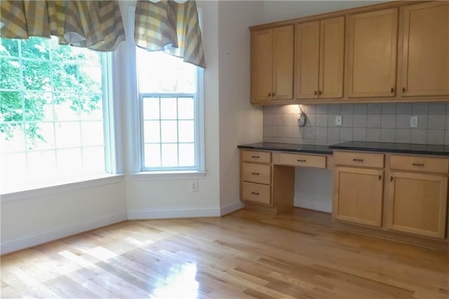 430 English Ivy Way, Woodstock, GA 30188 - kitchen featuring backsplash, light wood finished floors, dark countertops, and baseboards