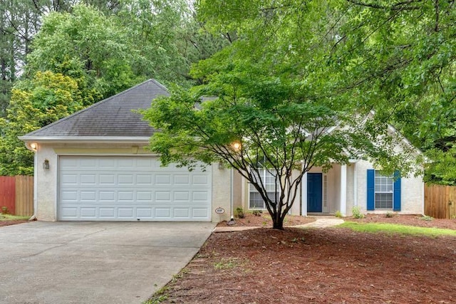 209 Southerness Ct, Stockbridge, GA 30281 - view of property hidden behind natural elements with concrete driveway, a garage, a shingled roof, and stucco siding