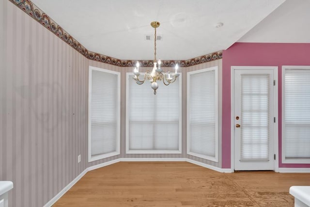 209 Southerness Ct, Stockbridge, GA 30281 - unfurnished dining area featuring a chandelier and light wood finished floors