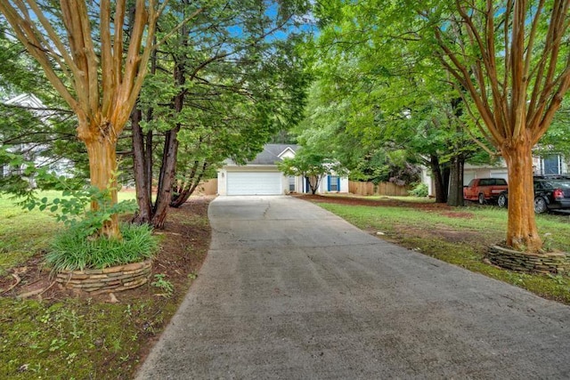 209 Southerness Ct, Stockbridge, GA 30281 - obstructed view of property featuring concrete driveway and an attached garage