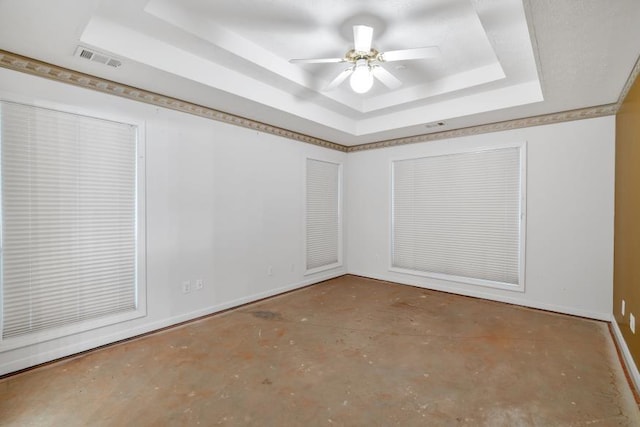 209 Southerness Ct, Stockbridge, GA 30281 - unfurnished room featuring a raised ceiling, concrete flooring, and ceiling fan