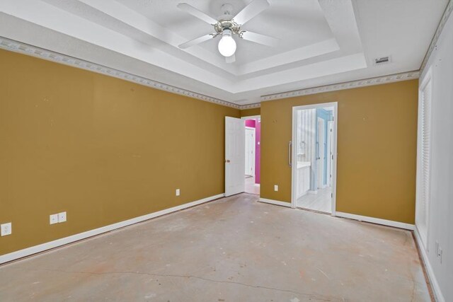 209 Southerness Ct, Stockbridge, GA 30281 - unfurnished bedroom featuring a tray ceiling, unfinished concrete flooring, and ensuite bathroom