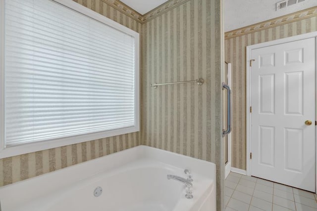 209 Southerness Ct, Stockbridge, GA 30281 - bathroom featuring wallpapered walls, tile patterned floors, a garden tub, and a stall shower