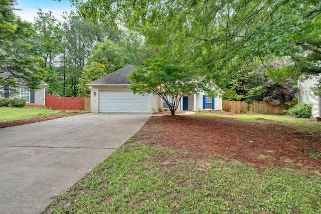 209 Southerness Ct, Stockbridge, GA 30281 - obstructed view of property featuring driveway, an attached garage, and stucco siding