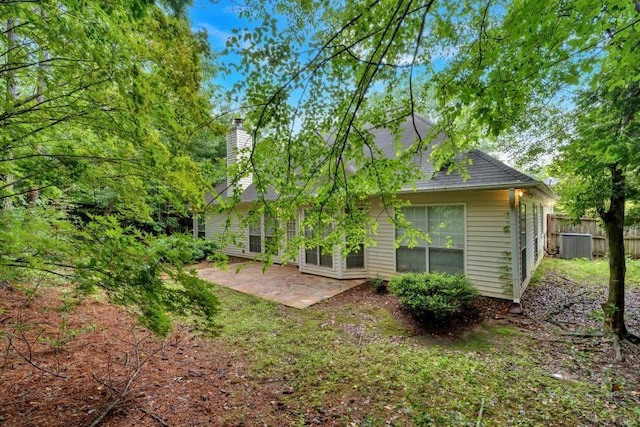 209 Southerness Ct, Stockbridge, GA 30281 - rear view of house with a patio area and a chimney