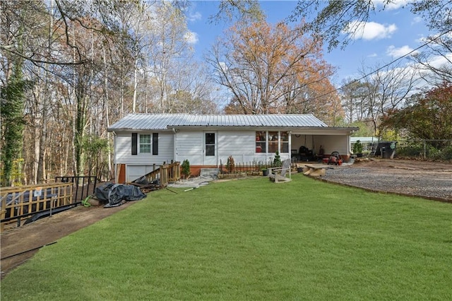 back of house featuring a yard