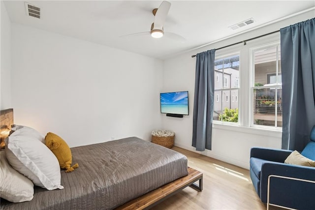 bedroom featuring wood finished floors and a ceiling fan