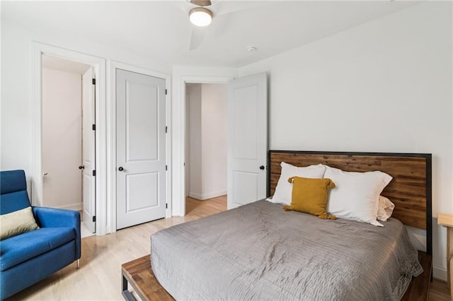 bedroom featuring light wood-style floors and a ceiling fan