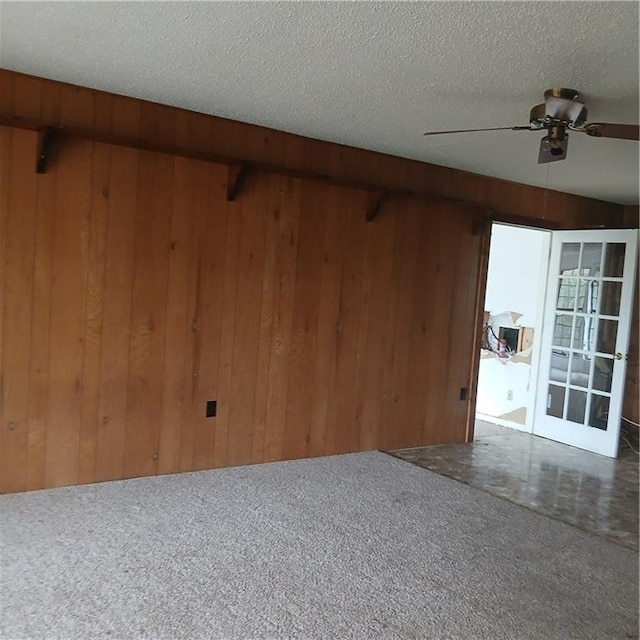 7203 Murphy Hwy, Mineral Bluff, GA 30559 - carpeted empty room with wood walls, a ceiling fan, and a textured ceiling