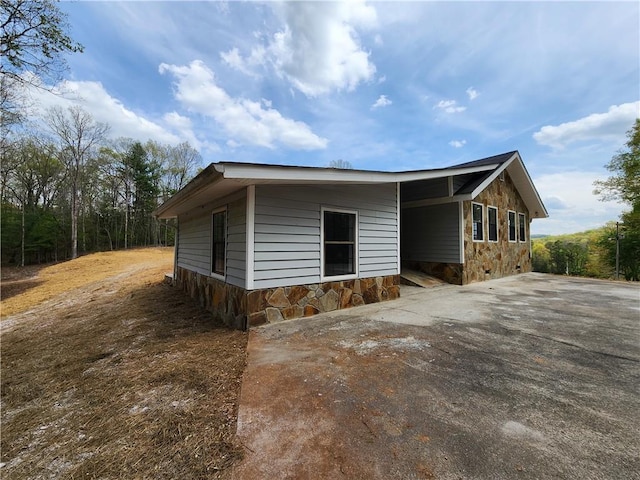 7203 Murphy Hwy, Mineral Bluff, GA 30559 - view of side of home featuring stone siding and driveway