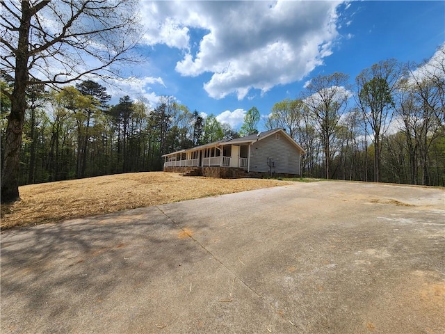 7203 Murphy Hwy, Mineral Bluff, GA 30559 - view of front of house featuring driveway and a wooded view
