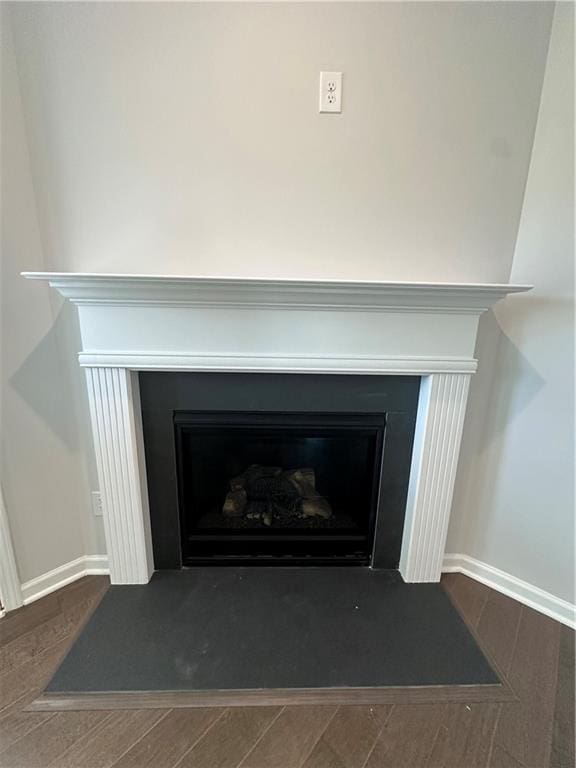 861 Pineberry Ct, Grayson, GA 30017 - detailed view of a fireplace with flush hearth and wood finished floors