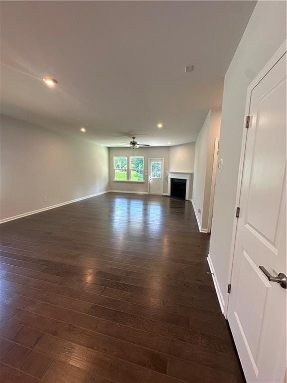 861 Pineberry Ct, Grayson, GA 30017 - unfurnished living room featuring ceiling fan, dark wood-type flooring, a fireplace, and recessed lighting