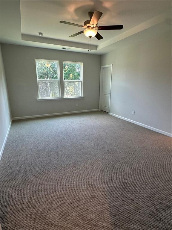 861 Pineberry Ct, Grayson, GA 30017 - carpeted empty room featuring ceiling fan and baseboards