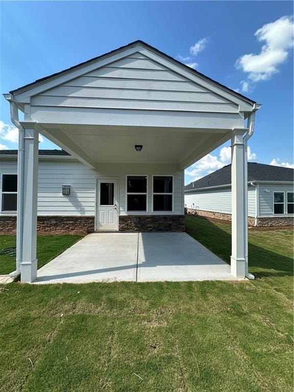 861 Pineberry Ct, Grayson, GA 30017 - back of property featuring a patio area and a lawn