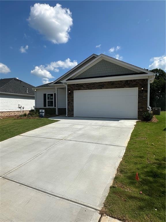 861 Pineberry Ct, Grayson, GA 30017 - single story home with stone siding, concrete driveway, and a front yard