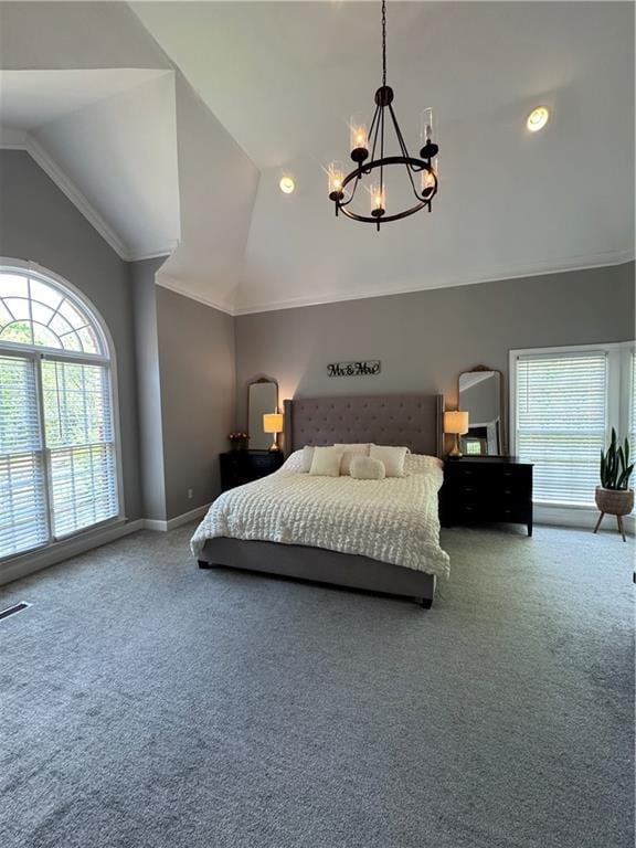 bedroom featuring carpet, an inviting chandelier, vaulted ceiling, visible vents, and baseboards