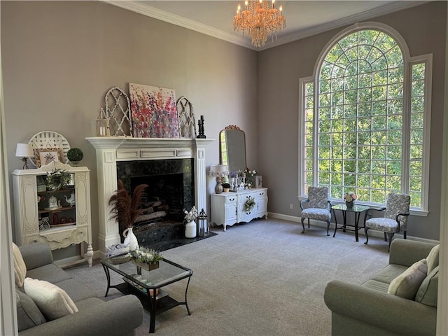 living room featuring a high end fireplace, a chandelier, baseboards, ornamental molding, and carpet flooring