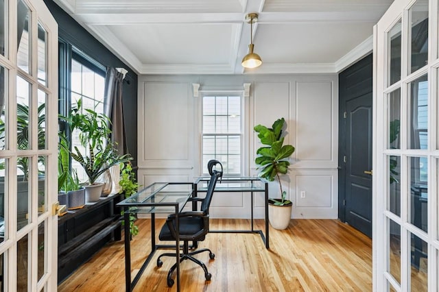 office featuring crown molding, beam ceiling, coffered ceiling, light hardwood / wood-style floors, and french doors