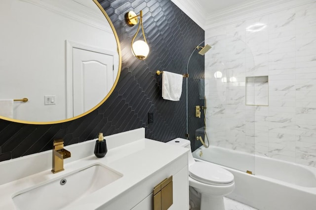 full bathroom featuring toilet, tile walls, ornamental molding, vanity, and tiled shower / bath combo