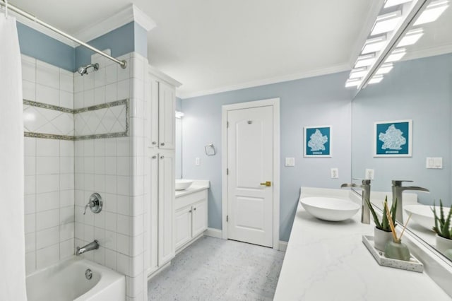 bathroom featuring vanity, ornamental molding, and tiled shower / bath