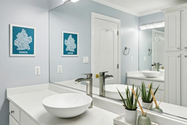 bathroom featuring ornamental molding and vanity