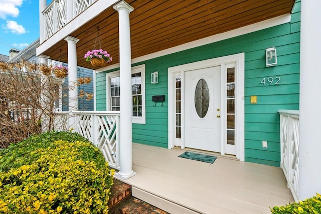 doorway to property with covered porch