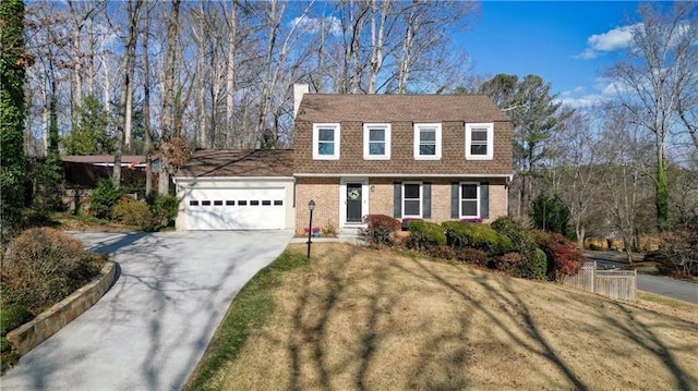 view of front facade featuring a garage and a front lawn