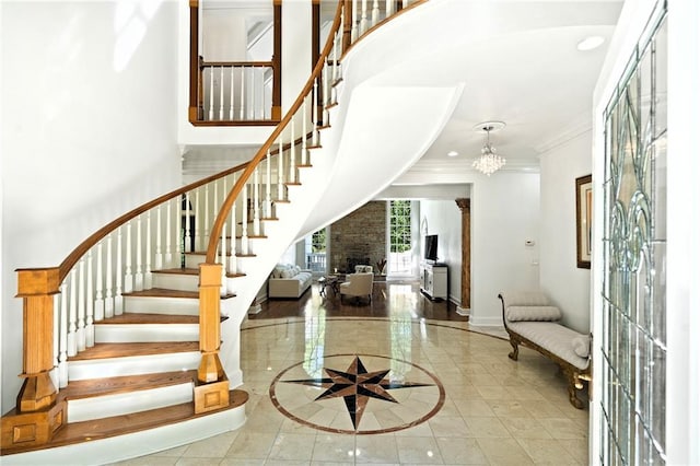4340 Candacraig, Johns Creek, GA 30022 - foyer entrance featuring inlaid floor details, crown molding, baseboards, stairway, and a high ceiling
