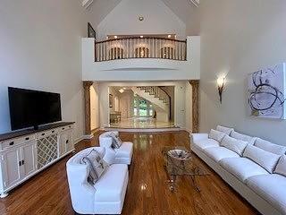 4340 Candacraig, Johns Creek, GA 30022 - living room with wood finished floors and a towering ceiling