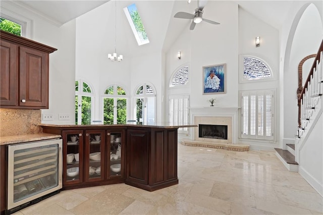 4340 Candacraig, Johns Creek, GA 30022 - bar featuring wine cooler, stairs, high vaulted ceiling, baseboards, and a ceiling fan